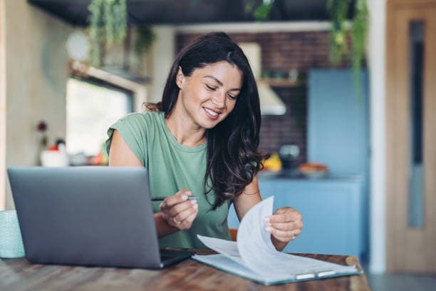 Accountant reviewing extracted invoice data on screen