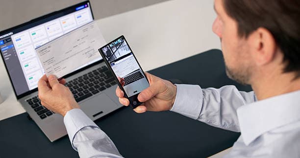 Person capturing a receipt with a mobile phone